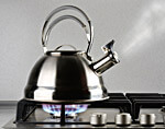 Heat water in a kettle.